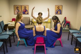 Bride and her bridesmaids share a candid moment in the nursery at Grace Episcopal Church in Alexandria, VA, just before the ceremony.